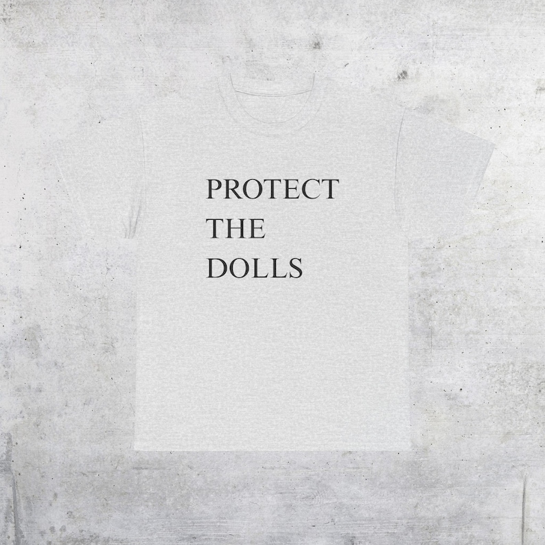 Camiseta con el lema "Protege a las muñecas": Derechos trans, orgullo queer - Camiseta unisex Ash