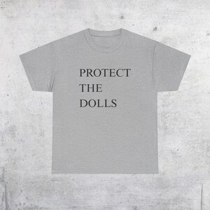 Camiseta con el lema "Protege a las muñecas": Derechos trans, orgullo queer - Camiseta unisex Sport Grey