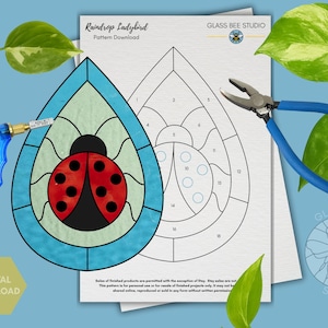 May include: A digital download pattern for a stained glass raindrop ladybug design. The image includes a blue glass cutter, blue pliers, and a pattern sheet with the text "Raindrop Ladybird Pattern Download" and "Glass Bee Studio".