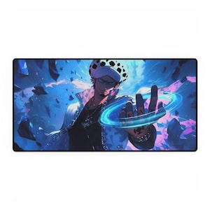 May include: Rectangular mousepad featuring a detailed illustration of a character from the anime series One Piece. The character is depicted with a white and black spotted hat, a white jacket, and a blue energy ring around his hand. The background is a mix of blue and purple.