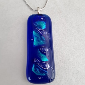 Dark Blue Fused Glass Pendant with Blue Highlights and a 24&quot; silver chain and gift box. Give as a gift or wear yourself.
