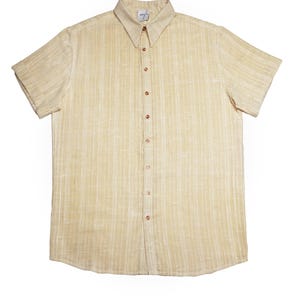 May include: A short-sleeved, button-down shirt in a light beige color with vertical striped detailing. The shirt has a classic collar and brown buttons. The fabric appears to be a textured weave.