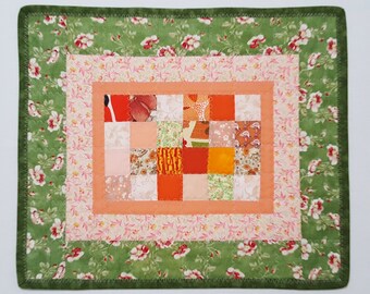 Green and peach table quilt, reversible table topper, floral patchwork quilt on one side, wildlife patchwork on back side