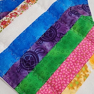 Handmade quilted multi-colored pot holders or hot pads are useful and fun. Add a spark of color to your cooking. They work as a trivet too.