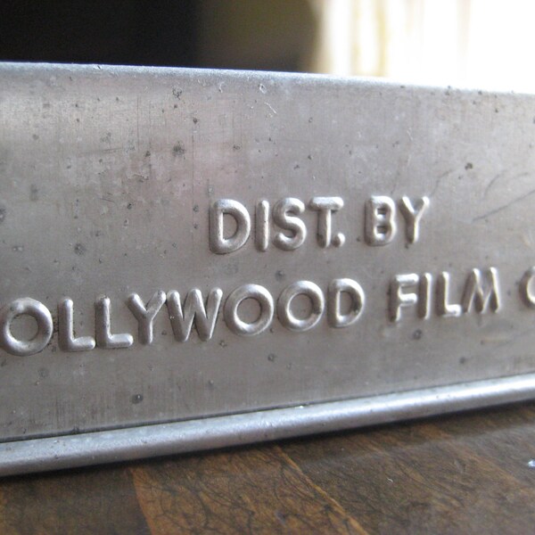 Distributed by Hollywood Film Co. film tins -- aluminum