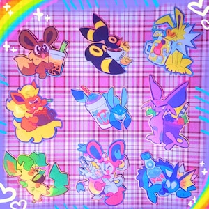 May include: A selection of vibrant cartoon character stickers, each showcasing a different creature with drinks. The stickers feature a rainbow, hearts, and a plaid background. The characters are in shades of brown, yellow, blue, pink, and green.