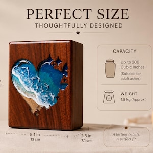 May include: A wooden urn with a heart-shaped ocean design. The urn is 7.0 inches (17.8 cm) tall, 5.1 inches (13 cm) wide, and 2.8 inches (7.1 cm) deep. It has a capacity of up to 200 cubic inches and weighs 1.8 kg. The text reads "PERFECT SIZE" and "THOUGHTFULLY DESIGNED."