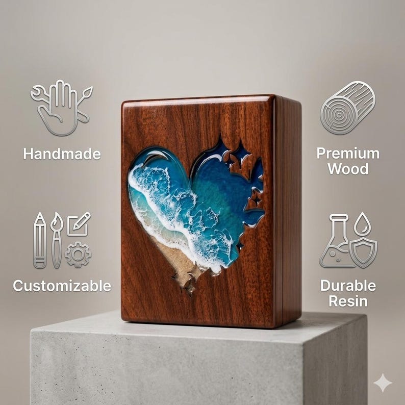 May include: A wooden box with a heart-shaped cutout revealing a blue and white ocean scene. The box is made of dark wood and sits on a gray concrete block. The words "Handmade", "Customizable", "Premium Wood", and "Durable Resin" are displayed.