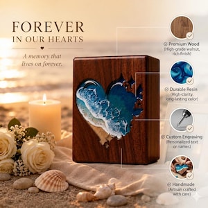 May include: A wooden box with a heart-shaped resin design depicting ocean waves. The box is made of high-grade walnut and features the text "FOREVER IN OUR HEARTS". A candle, flowers, and seashells are in the background.