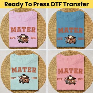 May include: A white ceramic mug with a black handle and the text "But First, Coffee" in a bold, black font. The mug is set against a neutral background, highlighting its simple design.