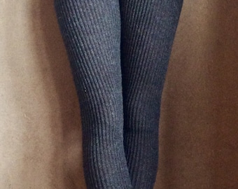 May include: Gray ribbed knit leggings with a drawstring waist.