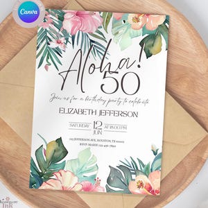 May include: A white invitation card with the text "Aloha! 50" and floral illustrations. The card includes details for a birthday party, such as the date, time, and location. The card is placed on a wooden tray with a brown envelope.