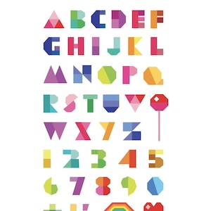 May include: A colourful alphabet quilt pattern with letters, numbers, and symbols in a rainbow colour scheme. The pattern includes a plus sign, exclamation mark, full stop, rainbow, and heart.