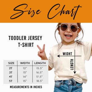 The image is a size chart for a toddler jersey t-shirt, showing the measurements for different age groups.