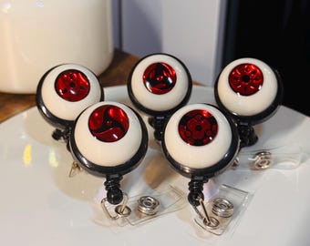 Carrete de insignia de ojo de anime hecho a mano