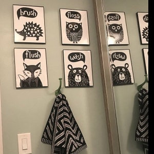May include: Black and white bathroom signs with animal illustrations and text that says "brush", "floss", "flush", "wash", "floss", "wash".