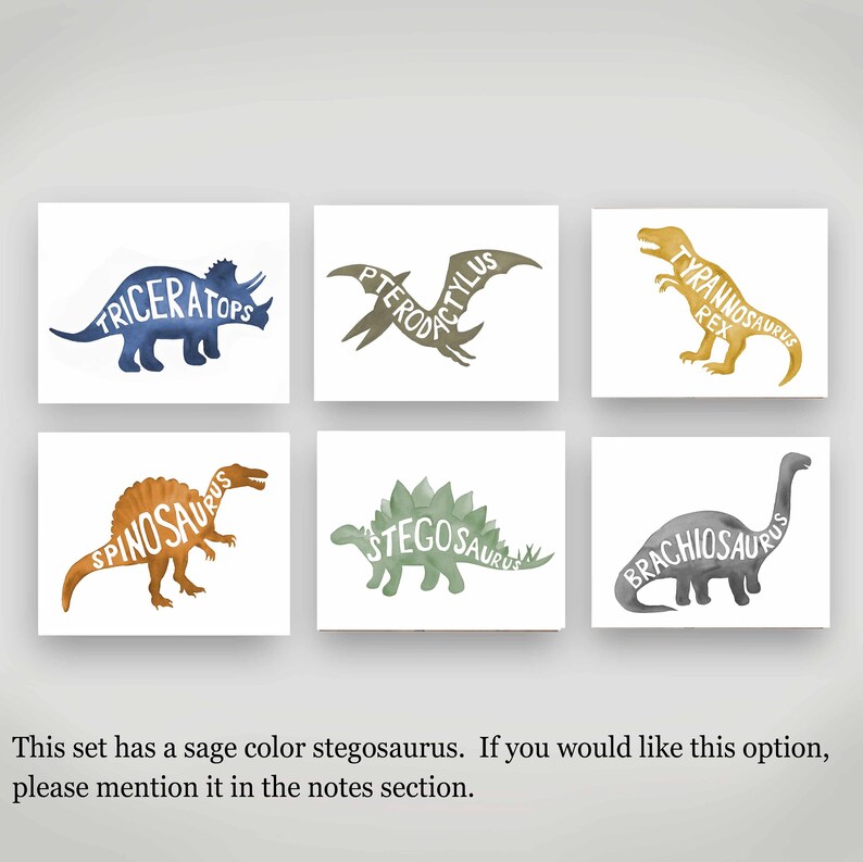 May include: Set of six watercolor dinosaur prints with the dinosaur names spelled out within the silhouette of each dinosaur. The dinosaurs are Triceratops, Pterodactyl, Tyrannosaurus Rex, Spinosaurus, Stegosaurus, and Brachiosaurus.