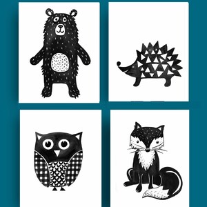 May include: Four black and white illustrations of woodland animals: a bear, a hedgehog, an owl, and a fox. The illustrations are simple and stylized, with a minimalist aesthetic.