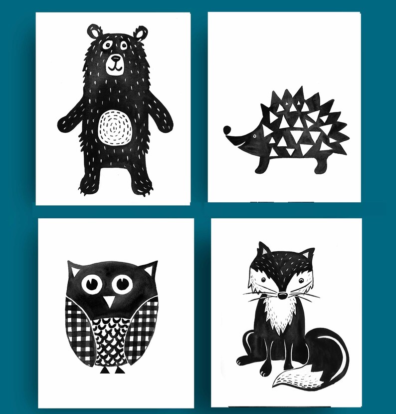 May include: Four black and white illustrations of woodland animals: a bear, a hedgehog, an owl, and a fox. The illustrations are simple and stylized, with a minimalist aesthetic.
