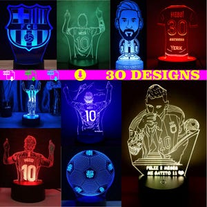 May include: A selection of LED lamps with soccer player designs. The lamps display different poses and jersey designs, including the FCB logo and the name "MESSI" with the number 10. The text "30 DESIGNS" is also visible.