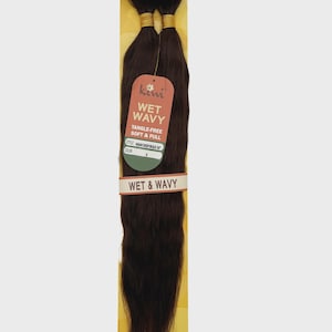 May include: Dark brown Kiwi brand human hair extensions, labeled "Wet Wavy". The packaging includes the text "Tangle-Free Soft & Full". The hair is bundled and secured with gold-colored ties.