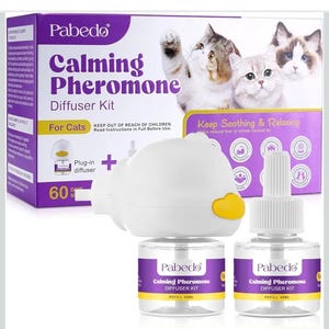 May include: A calming pheromone diffuser kit for cats, including a plug-in diffuser, two refill bottles, and a box with cat images. The kit provides a 60-day supply of calming pheromones to reduce fear or stress.