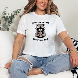 Funny Raccoon Overthinking T-Shirt: Coffee Meme Graphic Tee