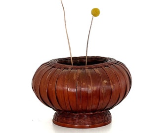 round woven rattan basket planter on pedestal vase | indoor flower pot