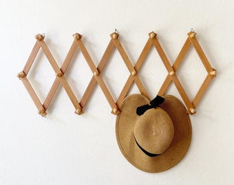 bulky wood accordion wood peg wall hanging rack / hat display storage / organizer