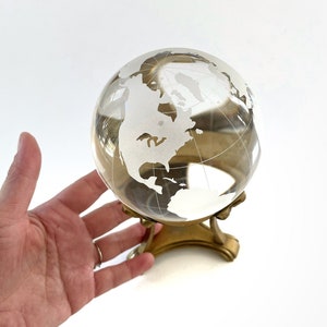 world glass ball globe office paperweight on a brass stand