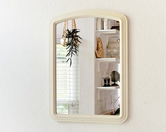 small white postmodern arched wall hanging mirror