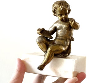 mid century brass baby pixie figurine on marble base paperweight