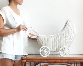 white wicker doll carriage