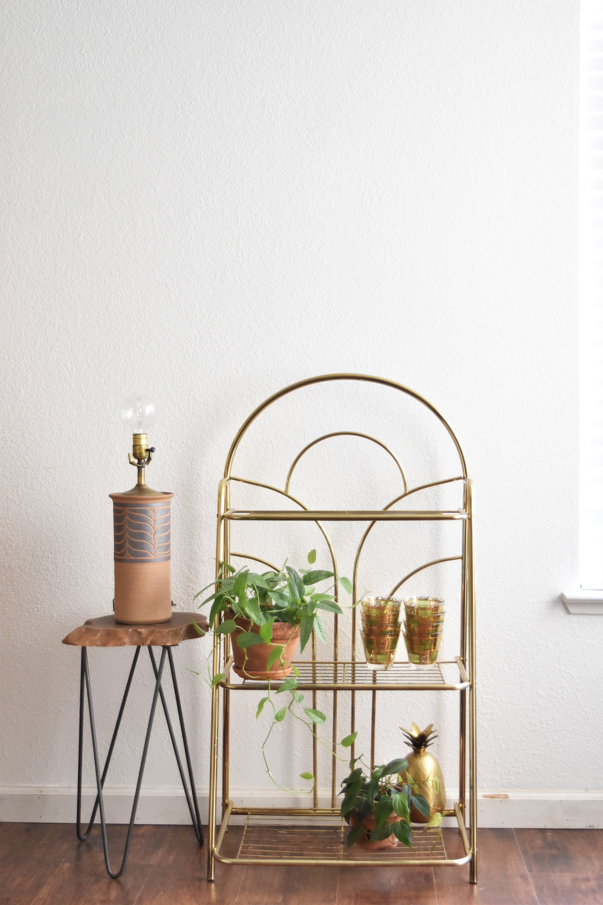 mid century modern gold tone magazine file plant stand
