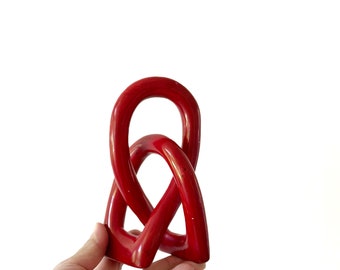 abstract african red minimalist interlocking soap stone sculpture