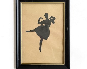 small framed vintage black ballerina silhouette on a tan background: ballet dancer