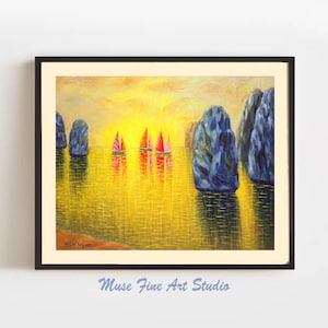 May include: An oil painting of a seascape with sailboats and rock formations. The sailboats have pink and red sails, and the water reflects the warm colors of the sunset. The painting is framed in a black frame.