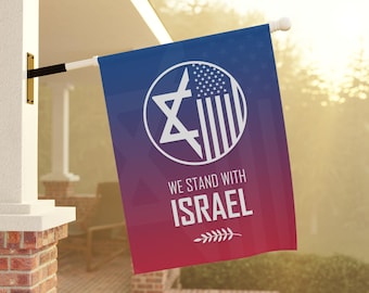 May include: A rectangular flag with a blue to red gradient background. The flag features a white Star of David and American flag design within a circle, with the words "WE STAND WITH ISRAEL" in white.