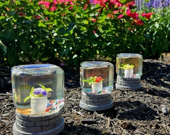 Butterfly Jarhead (Handmade snow globe containing a floral centerpiece and dancing butterflies)