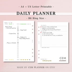 May include: A printable daily planner with a B6 ring size, featuring sections for tasks, notes, and priorities. The planner includes prompts for brain dumps, water intake, and mood tracking. Text on the planner includes "Execute 1 Hour of Deep Work" and "Phone out of sight."