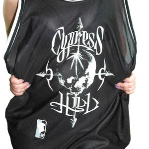 May include: Black mesh basketball jersey with a white skull and crossbones graphic and the text "Cypress Hill".