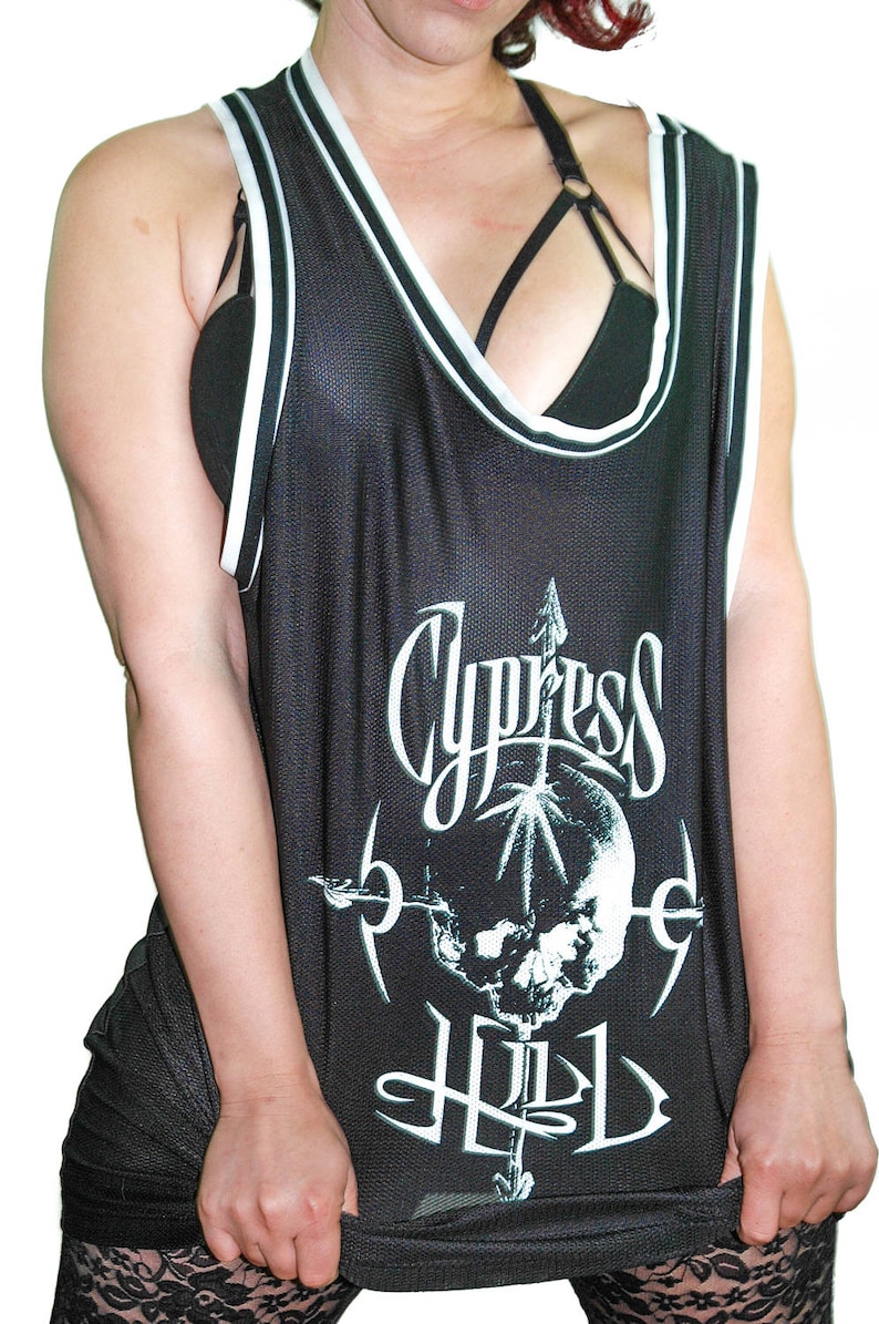 May include: Black basketball jersey with white trim and a skull graphic with the text "Cypress Hill" printed on the front.