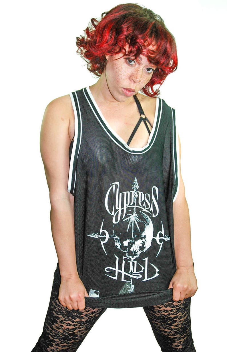 May include: Black mesh tank top with white trim and a skull graphic with the text "Cypress Hill" printed on the front.