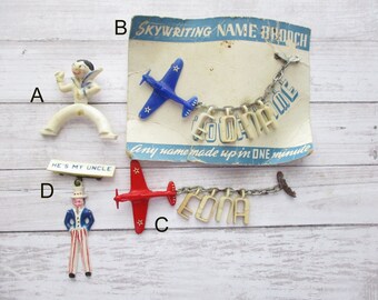 WWII Sweetheart Pins Airplane Skywriting Name Uncle Sam Sailor Army Air Corps Early Plastic