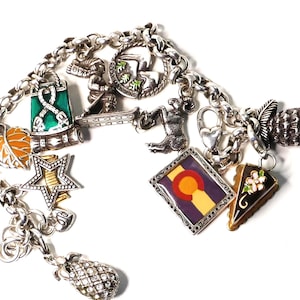 May include: A set of three ceramic mugs with a speckled, matte finish. The mugs are in shades of cream, light gray, and dark gray. Each mug has a simple, minimalist design, perfect for coffee or tea.