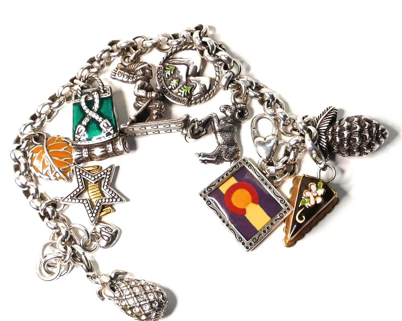 May include: A set of three ceramic mugs with a speckled, matte finish. The mugs are in shades of cream, light gray, and dark gray. Each mug has a simple, minimalist design, perfect for coffee or tea.