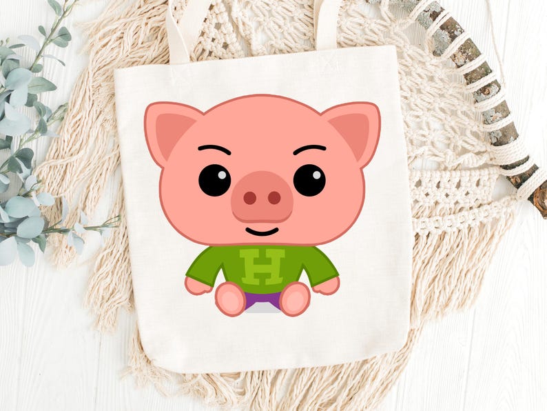 May include: A white tote bag featuring a cartoon pig illustration. The pig is pink with black eyes, a green shirt with a white "H", and purple shorts. The bag has two white handles and is set against a neutral background.