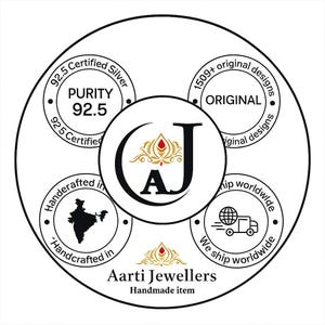 May include: Circular graphic with text and design elements. The central circle features the letters "AJ" and a floral design. Surrounding circles display text including "92.5 Certified Silver", "Handcrafted in", and "1509+ original designs". The words "Aarti Jewellers" are also visible.