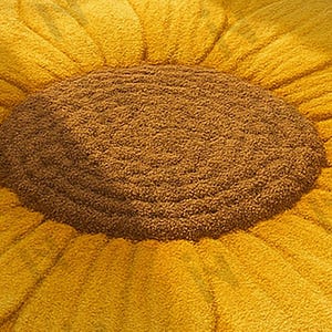 IN-108 Hand Tufted Sunflower Woolen Carpet for Floor Decor, Cozy Home,Bedroom, Courtyard, Living Room, Kids, Cabin, Bedroom, Reading Nook.
A vibrant sunflower-shaped wool rug handcrafted in rich yellow and brown tones, featuring realistic petal textures and a plush wool surface. Displayed in a bright minimalist room with indoor plants, natural sunlight, and a wooden bench, this handmade rug adds a cheerful botanical touch and cozy warmth to any modern living space.