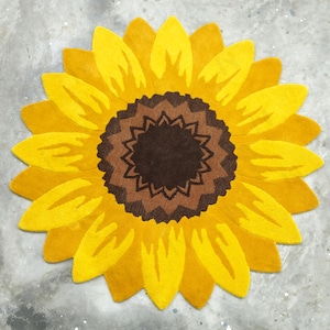 IN-108 Hand Tufted Sunflower Woolen Carpet for Floor Decor, Cozy Home,Bedroom, Courtyard, Living Room, Kids, Cabin, Bedroom, Reading Nook.
A vibrant sunflower-shaped wool rug handcrafted in rich yellow and brown tones, featuring realistic petal textures and a plush wool surface. Displayed in a bright minimalist room with indoor plants, natural sunlight, and a wooden bench, this handmade rug adds a cheerful botanical touch and cozy warmth to any modern living space.